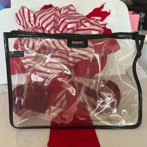 dkny large clutch bag plastic clear with top zipper black trim.